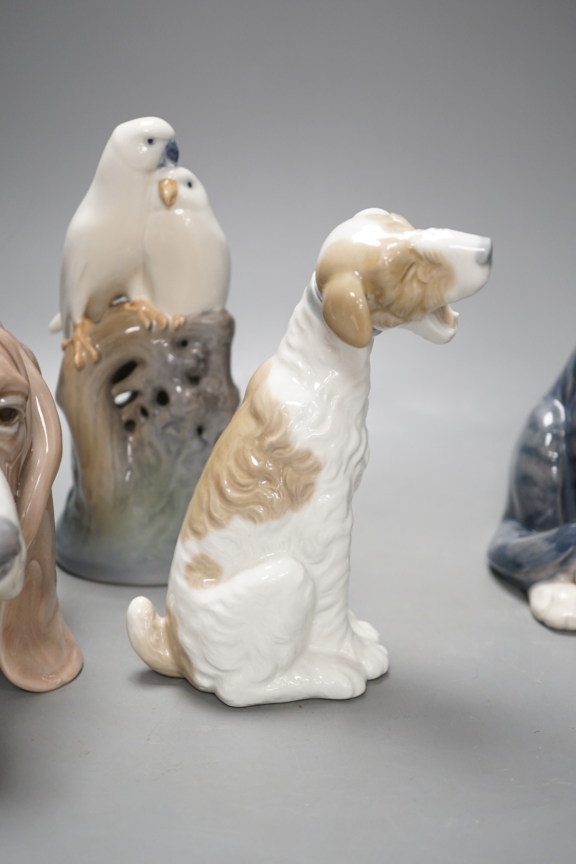 A Royal Copenhagen cat 304, love birds 649, dove 4727, a Lladro dog's head and a Nao figure of a yawning dog - tallest 19cm (5)